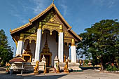 Vientiane, Laos - Pha That Luang, Other structures on the ground include a bell tower, several stupas, a number of pavilions sheltering images of the Buddha.  